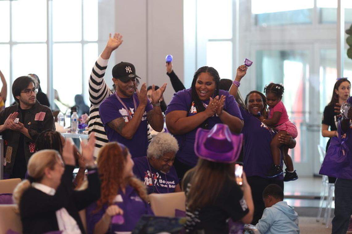 Community members cheer during Give Miami Day 2024 at the Royal Caribbean terminal at PortMiami.
