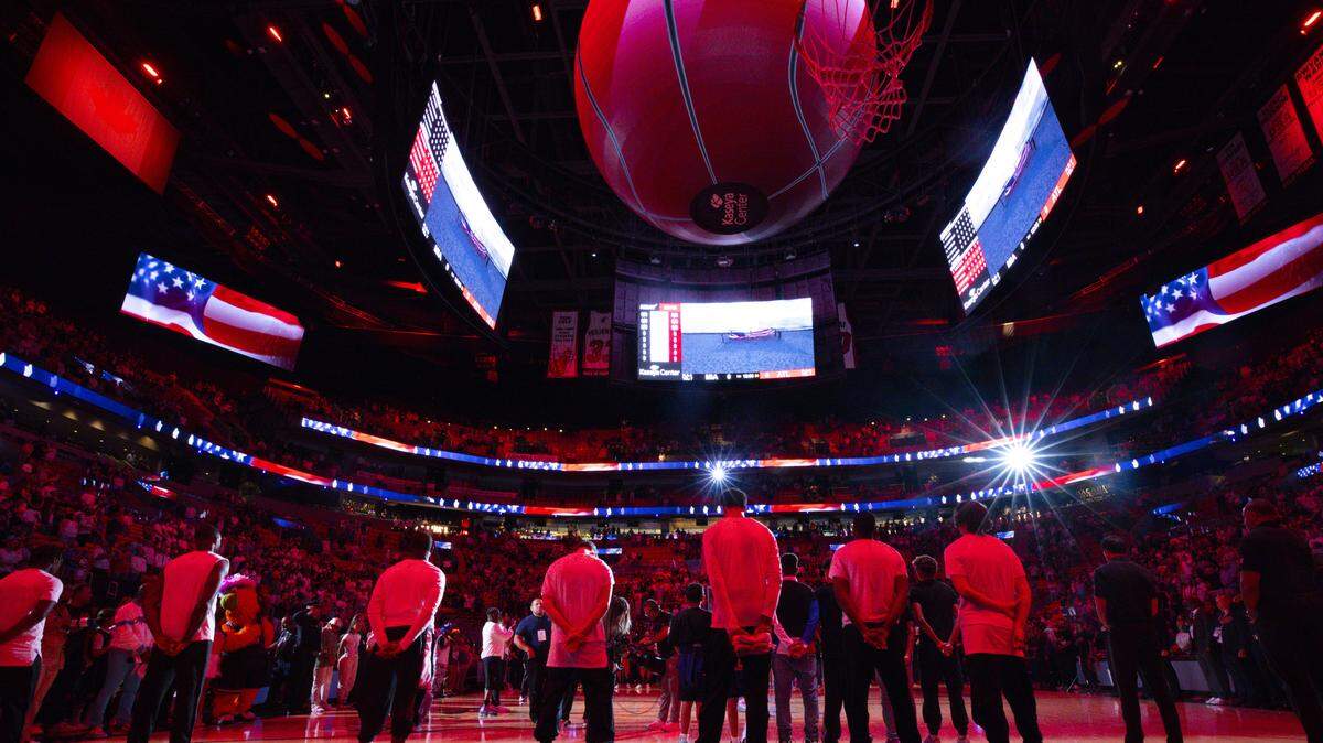 Miami Heat stand for the National Anthem before a game against the Atlanta Hawks on Thursday, March 27, 2025, at the Kaseya Center in downtown Miami, Fla. 