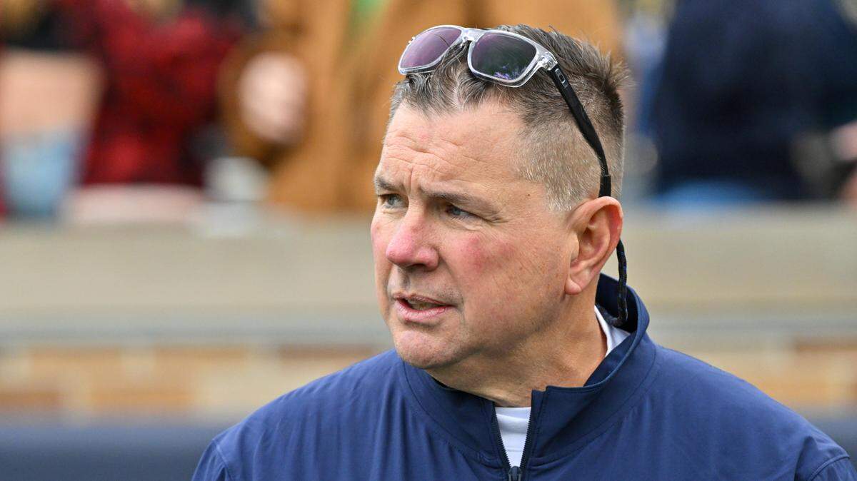 Nov 16, 2024; South Bend, Indiana, USA; Notre Dame Fighting Irish defensive coordinator Al Golden watches warmups before a game against the Virginia Cavaliers at Notre Dame Stadium.