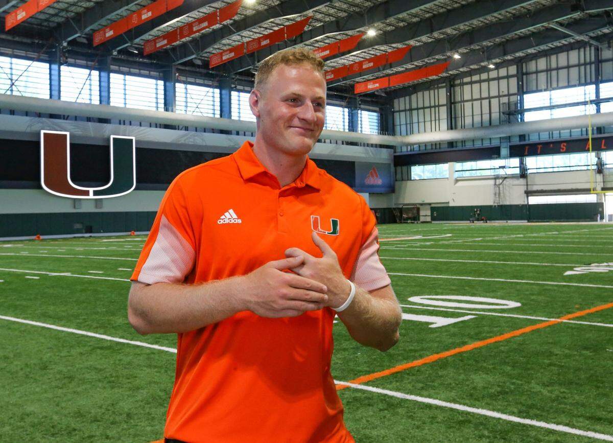 Miami Hurricanes quarterback Tyler Van Dyke (9) departs after speaking to reporters during Media Day in the Carol Soffer Indoor Practice Facility at the University of Miami on Tuesday, August 2, 2022.