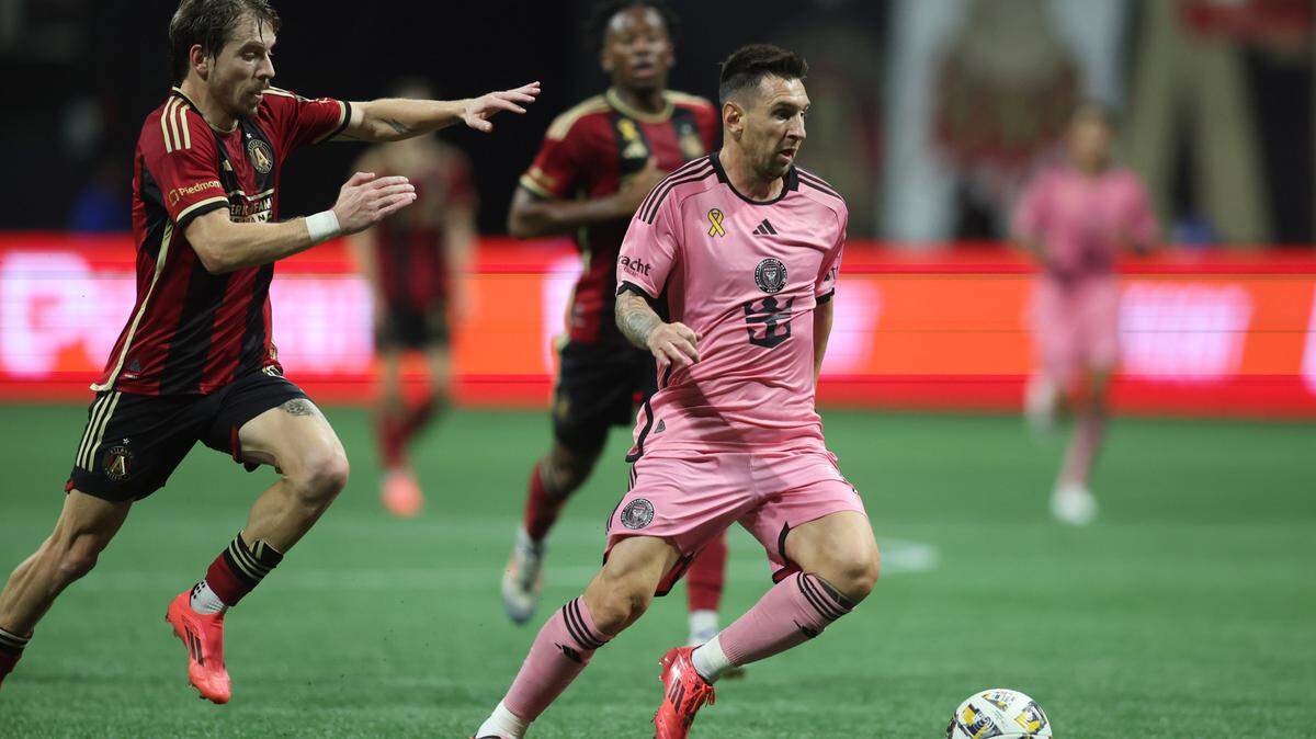 Sep 18, 2024; Atlanta, Georgia, USA; Inter Miami CF forward Lionel Messi (10) controls the ball against Atlanta United midfielder Saba Lobjanidze (9) in the second half at Mercedes-Benz Stadium. Mandatory Credit: Brett Davis-Imagn Images