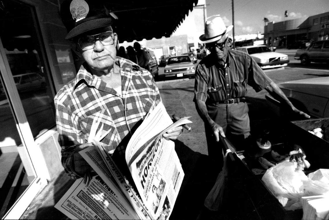 In 1993, Jose Baro looks over editions of weekly Spanish language newspapers he picked up at the Versailles restaurant in Little Havana.