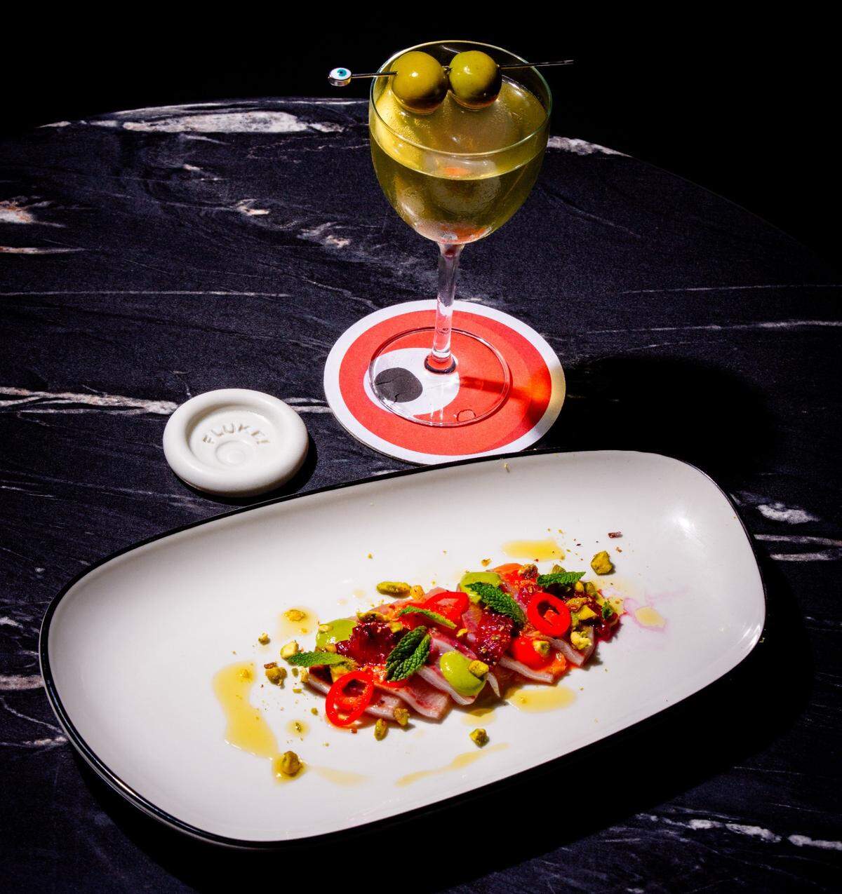 The menu at Fluke focuses on crudo and oysters, with some fried options as well. The cocktail program highlights martinis.