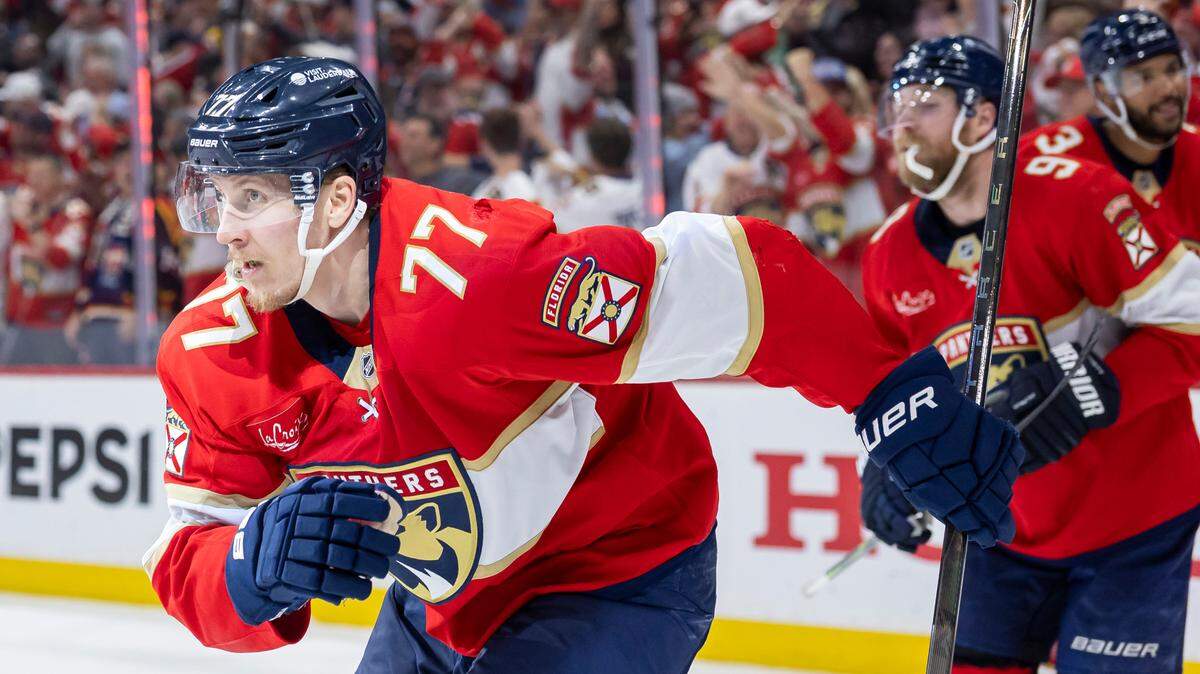 Florida Panthers defenseman Niko Mikkola (77) celebrates with his teammates after scoring against Carolina Hurricanes goaltender Pyotr Kochetkov (52) in the third period of Game 3 during the Eastern Conference final of the NHL Stanley Cup playoffs at Amerant Bank Arena on Saturday, May 24, 2025, in Sunrise, Fla.