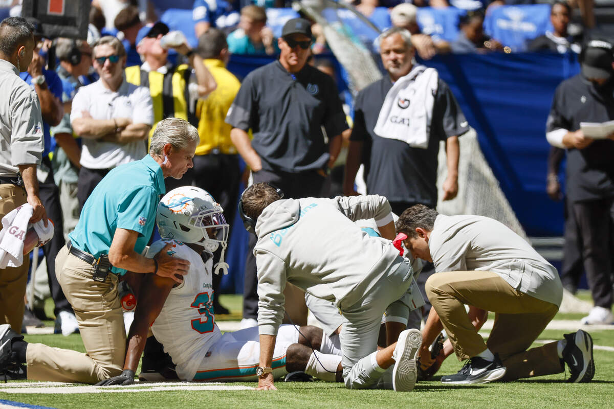 Miami Dolphins cornerback Storm Duck (36) receives medical attention after sustaining an injury during the first half of an NFL game against the Indianapolis Colts at Lucas Oil Stadium on Sunday, Sept. 7, 2025, in Indianapolis, Indiana.