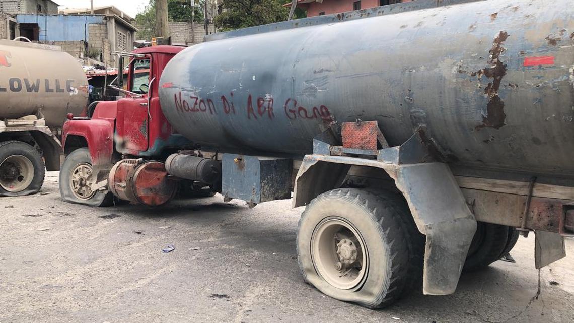 After an angry crowd in a Port-au-Prince neighborhood killed 13 suspected gang members on Monday, April 24, residents in the capital began erecting barricades from whatever they can find to protect themselves from encroaching, menacing gangs. This truck reads, “Nazon says down with gangs.”