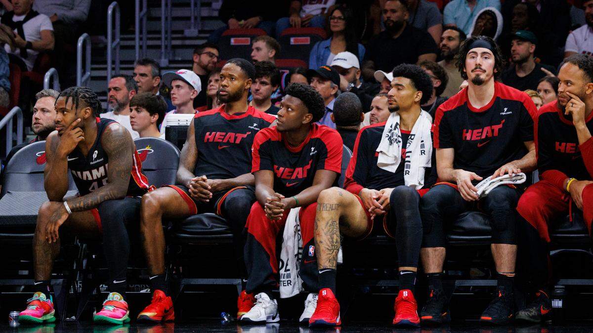 Miami Heat bench look to the court towards the end of a game against the LA Clippers on March 12, 2025, at Kaseya Center in Miami.