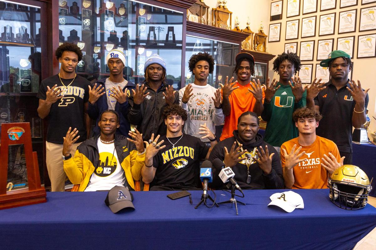 St. Thomas Aquinas football signees react during signing day at St.Thomas Aquinas High School in Fort Lauderdale, Florida, on Wednesday, December 20, 2023.