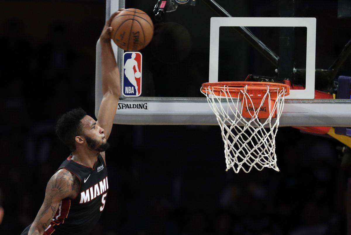 Miami Heat’s Derrick Jones Jr. (5) dunks against the Los Angeles Lakers during the first half of an NBA basketball game Monday, Dec. 10, 2018, in Los Angeles. (AP Photo/Marcio Jose Sanchez)