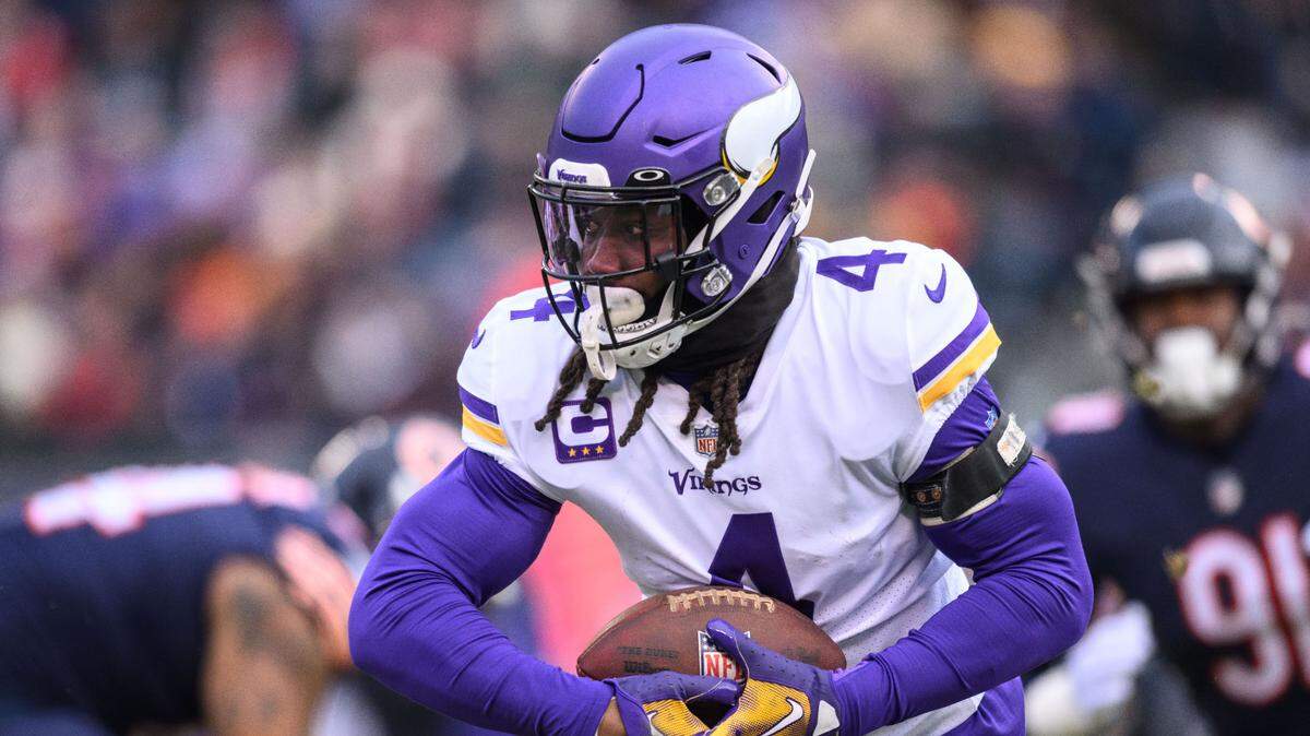 Jan 8, 2023; Chicago, Illinois, USA; Minnesota Vikings running back Dalvin Cook (4) runs the ball during the first quarter against the Chicago Bears at Soldier Field. Mandatory Credit: Daniel Bartel-USA TODAY Sports