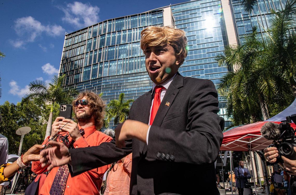 Comedian Jason Scoop impersonates former President Donald Trump in front of the Miami federal courthouse ahead of Trump’s court appearance, on Tuesday, June 13, 2023.