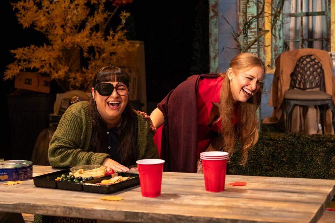 Joline Mujica as Ursula and Mallory Newbrough as Cailtin share drinks and a laugh in Zoetic Stage’s “The Comeuppance.”