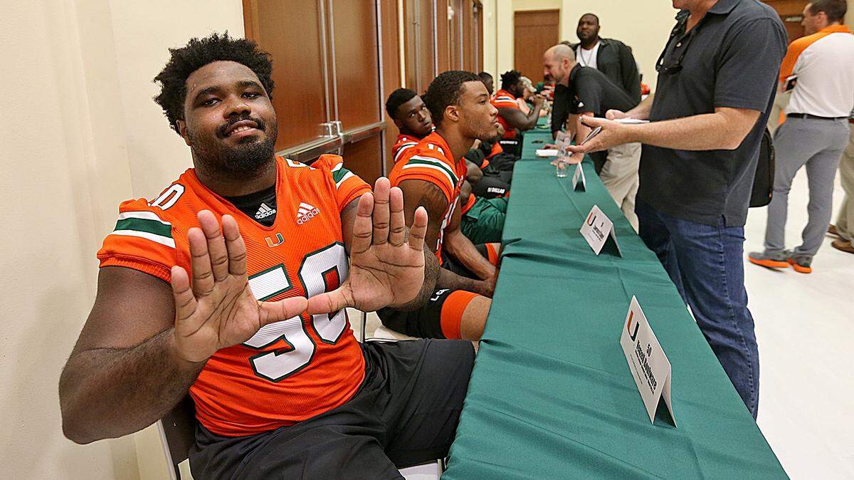 University of Miami offensive lineman Venzell Boulware throws up the U during Media Day at the University of Miami Newman Alumni Center on Monday, August 13, 2018.