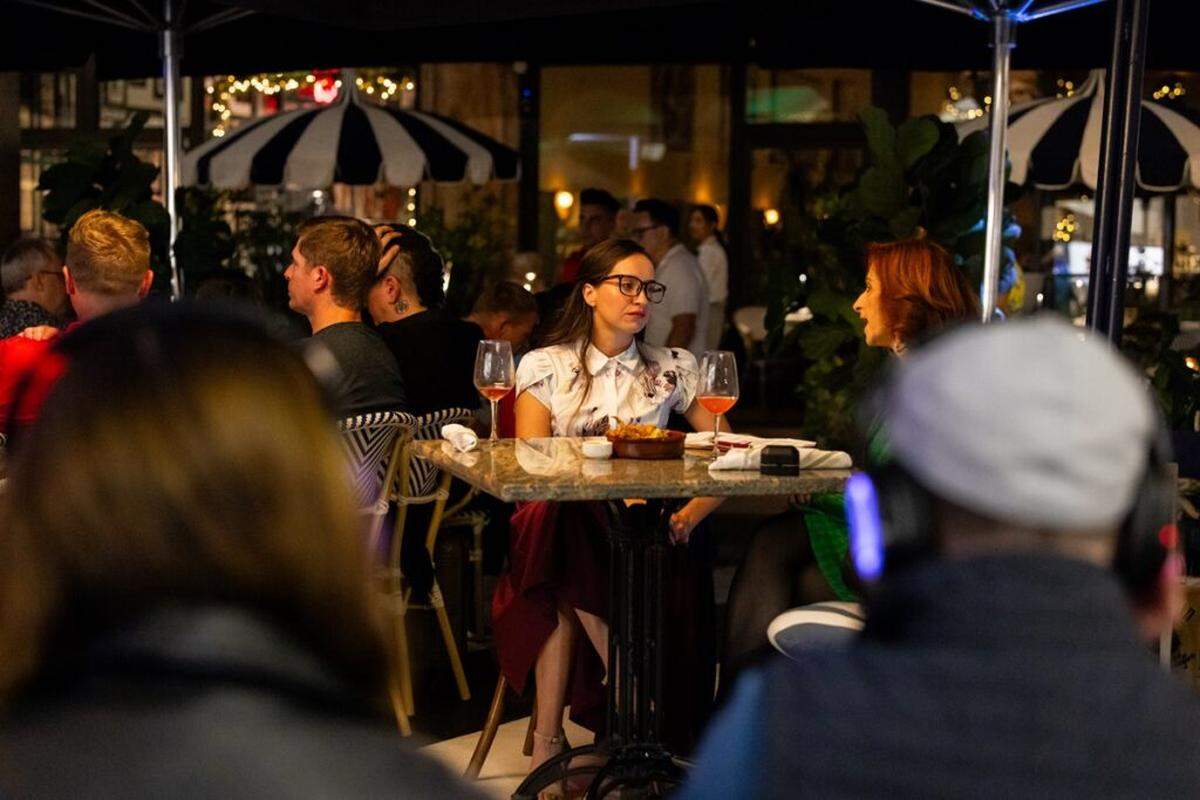 “Only Fandom” takes place at an outdoor table at the real Issabella’s where regular patrons are part of the action. Krystal Millie Valdes and Irene Adjan are a future daughter in law and mother in law in the short play.