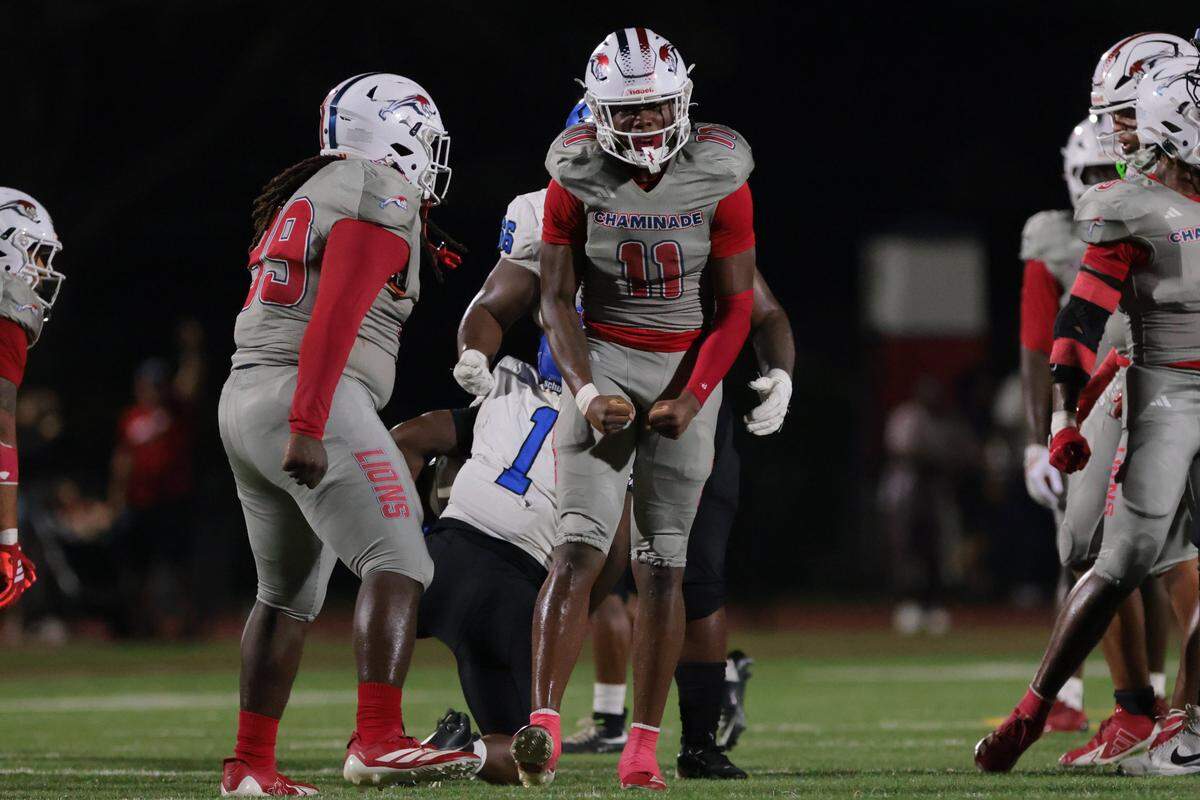 Chaminade-Madonna Lions defensive end Trevoris Finely (11) reacts after a sack against Trinity Christian Academy running back Micah Anderson (1) during the first half of a Class 1A football state semifinal game at Chaminade-Madonna College Preparatory on Friday, Dec. 5, 2025 in Hollywood, Fla. 