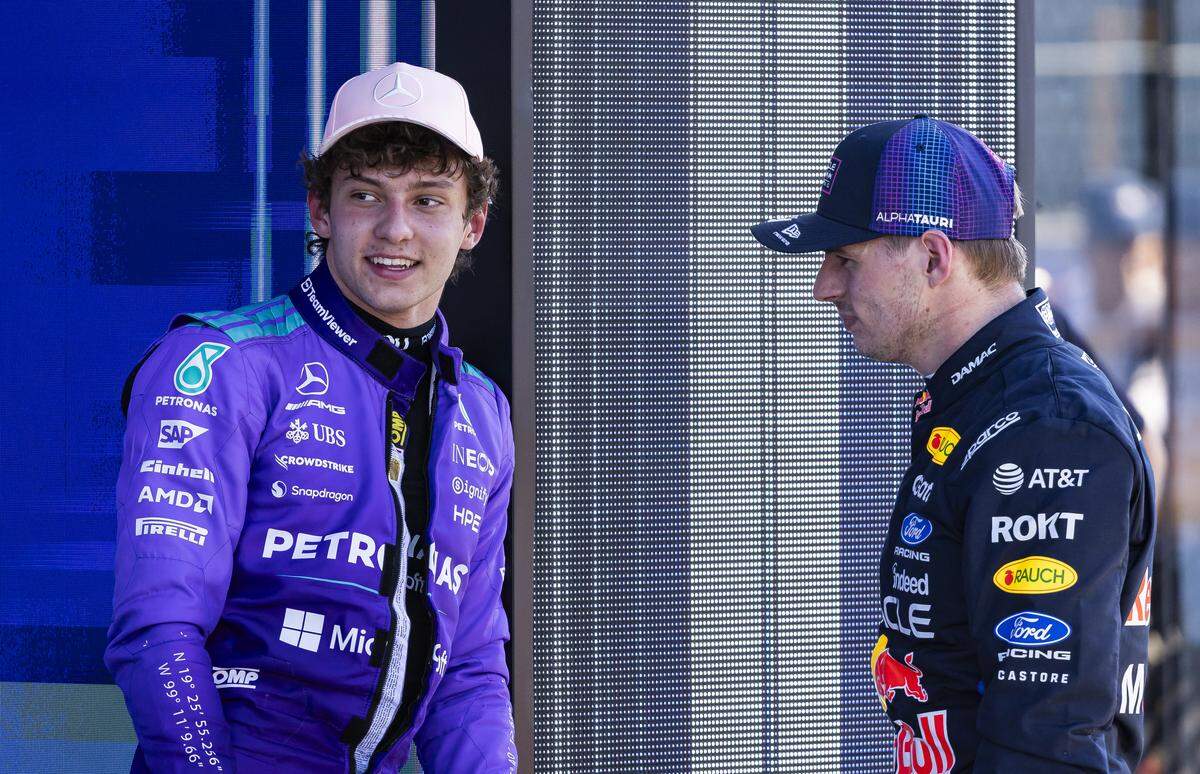 Kimi Antonelli of Italy, driver of the (12) Mercedes-AMG PETRONAS Formula One Team race car, and Max Verstappen of the Netherlands, driver of the (3) Oracle Red Bull Racing race car, talk after they participated in a Qualifying session on the second day of the Formula One Miami Grand Prix at the Miami International Autodrome on Saturday, May 2, 2026, in Miami Gardens, Fla.