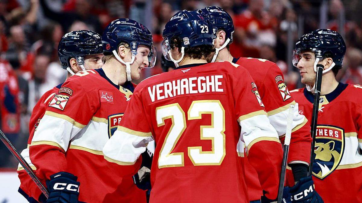 SUNRISE, FLORIDA - OCTOBER 11: Anton Lundell #15 of the Florida Panthers celebrates his goal with Carter Verhaeghe #23 and Evan Rodrigues #17 against the Ottawa Senators during the second period at Amerant Bank Arena on October 11, 2025 in Sunrise, Florida. (Photo by Carmen Mandato/Getty Images)