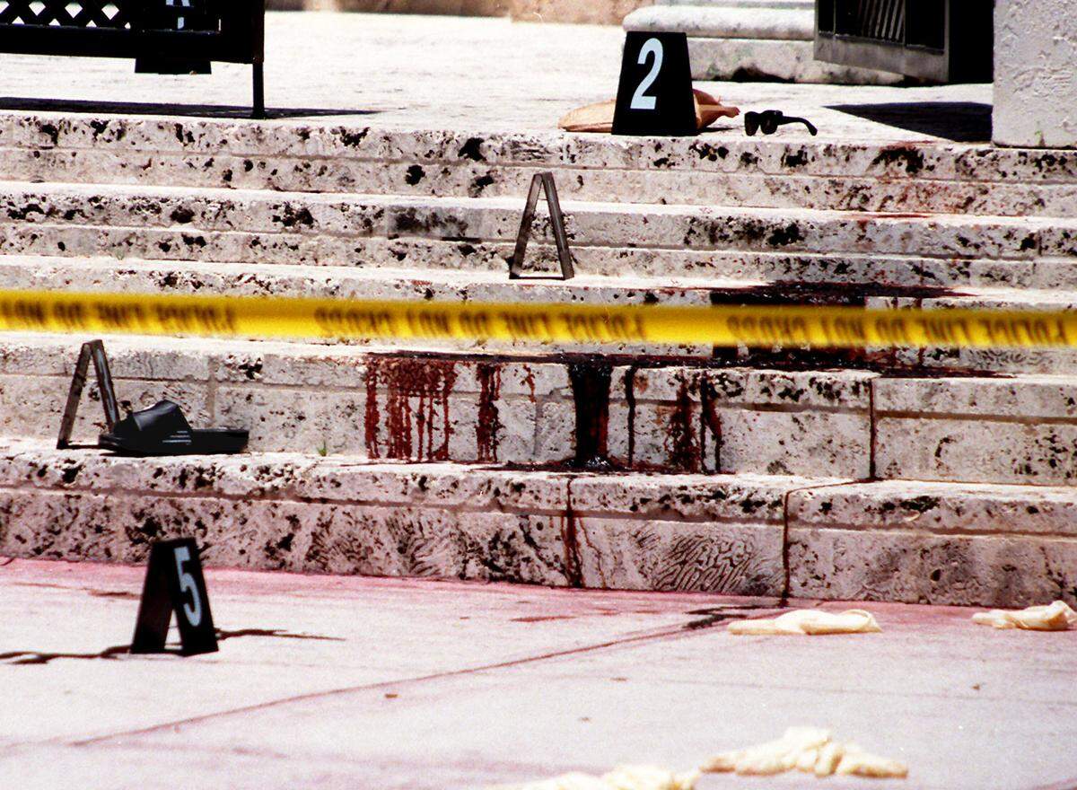 In this file photo from July 15, 1997, blood, a shoe and sunglasses were at the scene on the steps of fashion designer Gianni Versace’s South Beach mansion where he was killed that morning by an assassin’s bullets.