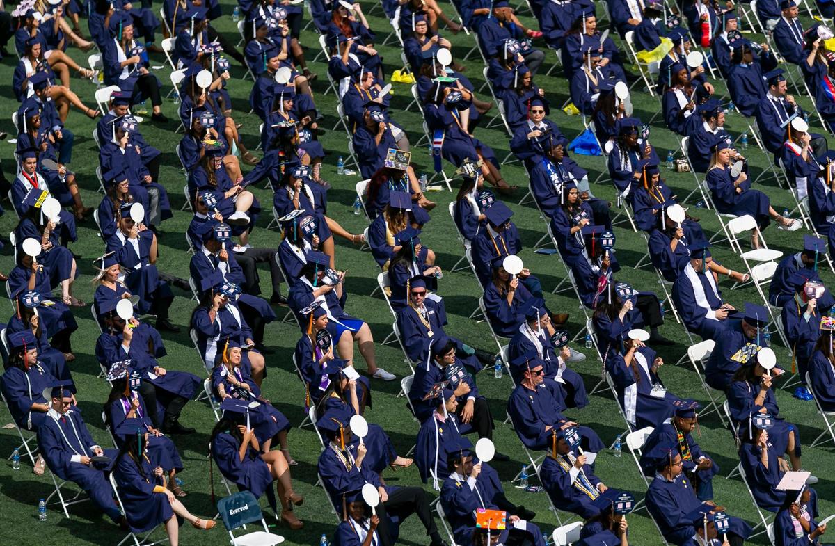 Florida International University students attend their graduation ceremony inside FIU’s Riccardo Silva Stadium in Miami, Florida on Saturday, April 30, 2022.