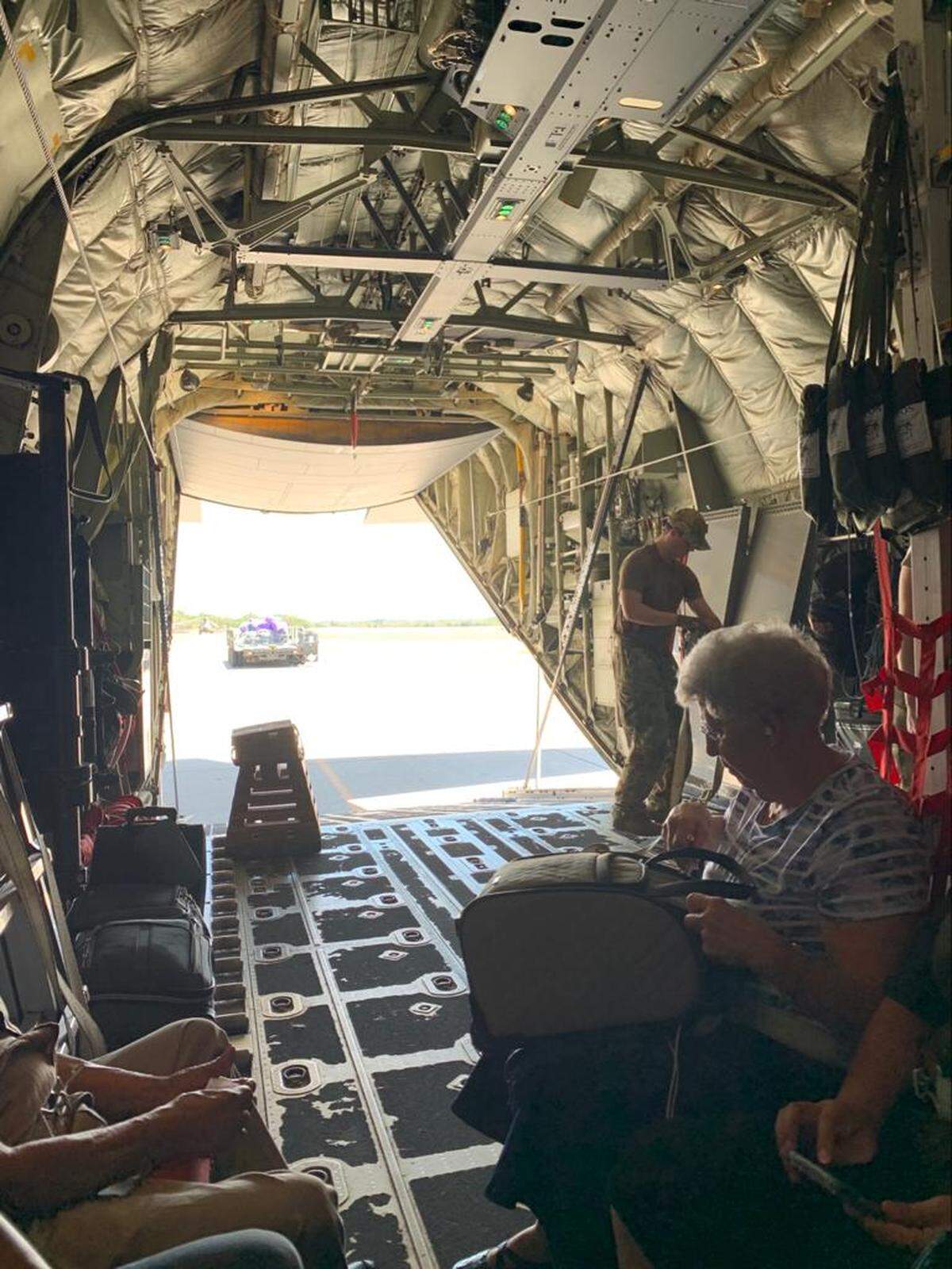 Richard Hubbard, his wife Cynthia Hubbard Arevalo and their in-laws Roberto Avila and Dunia Avila aboard a U.S. Air Force C-130 waiting to fly to Virginia after being stuck in Honduras due to the coronavirus.