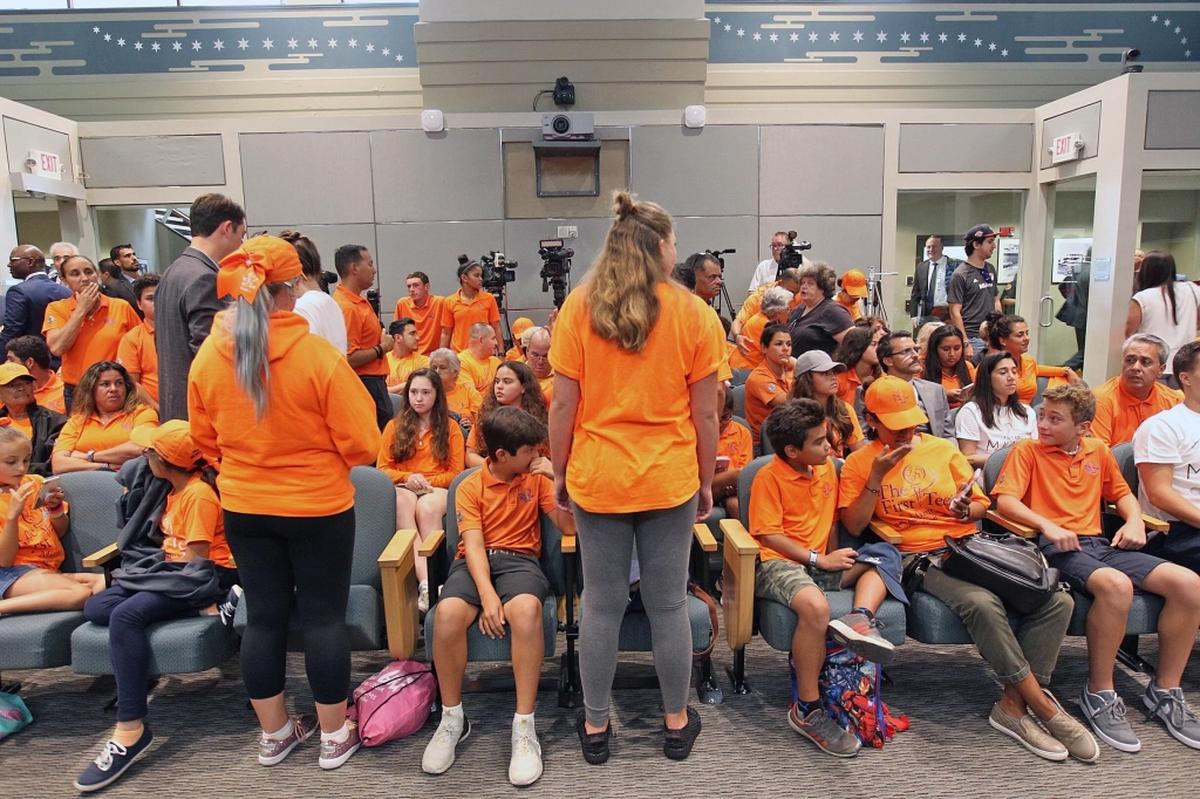 Members of First Tee Miami arrived early at the Miami City Commission meeting on Thursday, July 12, 2018, to voice opposition to a proposed soccer stadium and commercial development at Melreese golf course where the youth golf program is housed.