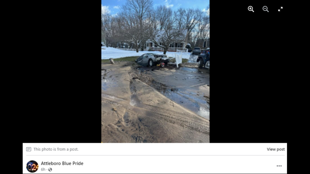 Nearly half of the van had been sucked into the ground by the sinkhole, photos showed.