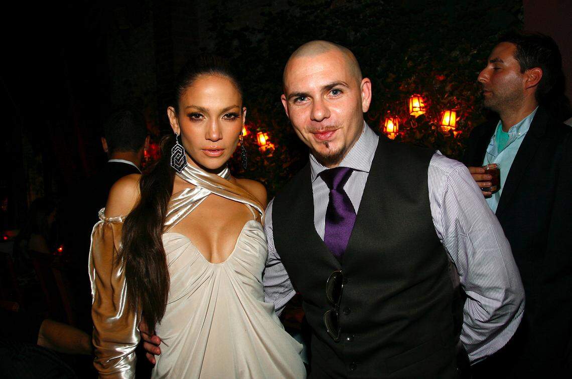 In 2009, Jennifer Lopez and Pitbull attend a post VMA dinner at The Waverly Inn in New York City.