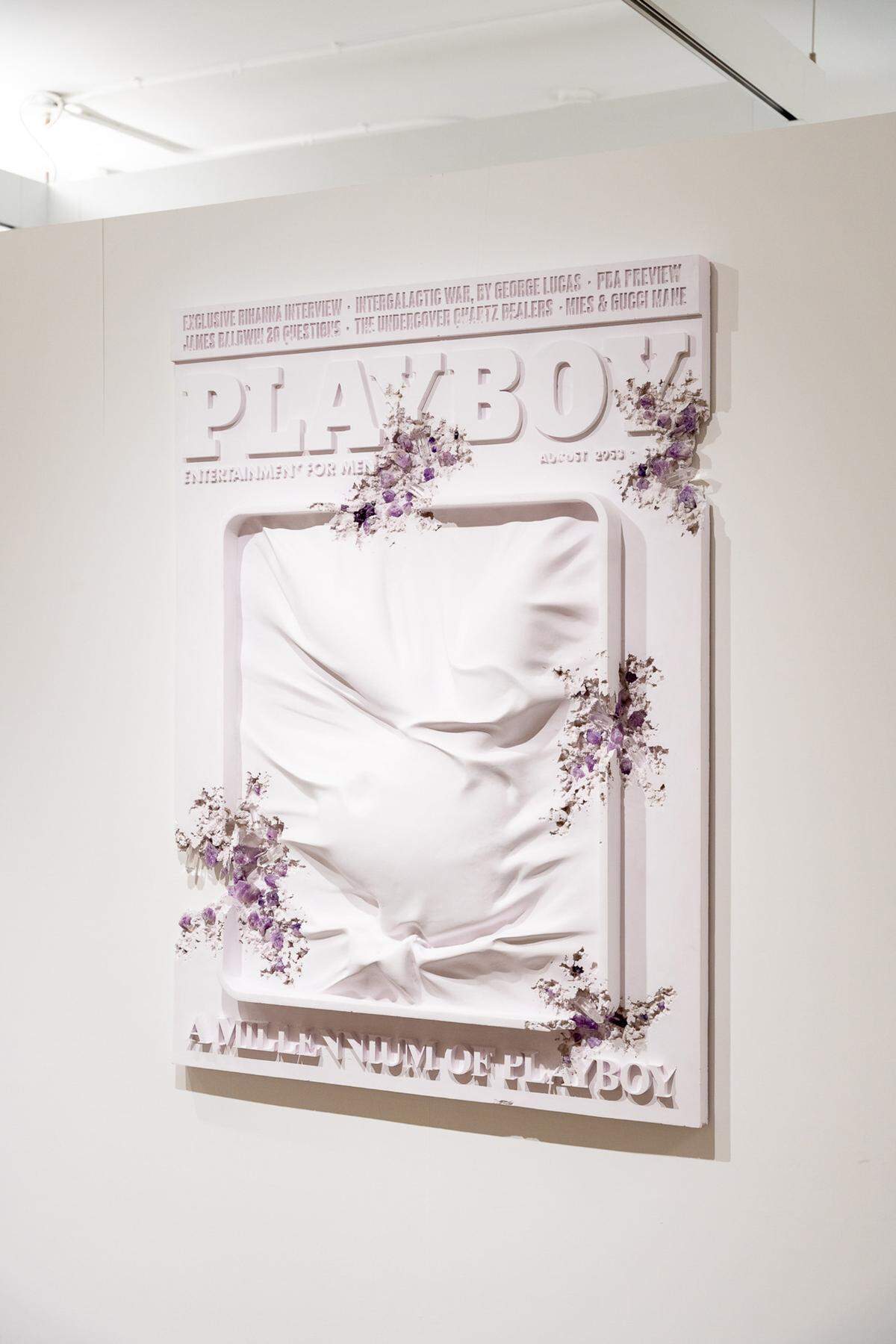 Daniel Arsham’s “Amethyst Eroded Playboy Logo (Large)” is a sculpture of a Playboy Magazine eroding with clusters of amethyst crystals.