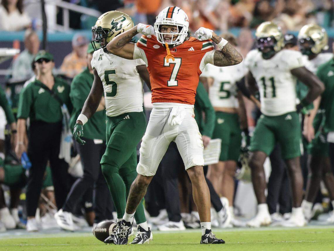 Miami Hurricanes wide receiver CJ Daniels (7) reacts after a first down reception against the South Florida Bulls during their NCAA football game at Hard Rock Stadium in Miami Gardens, Florida, on Saturday, September 13, 2025.