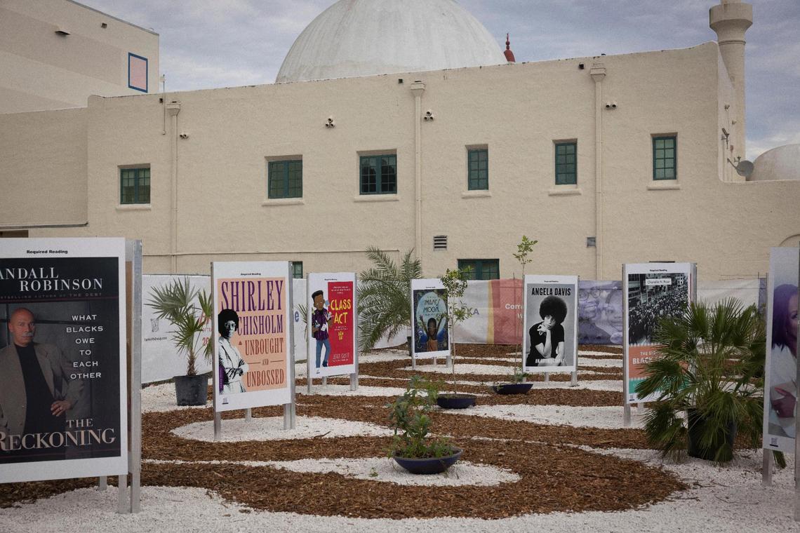 Required* Reading, a walk-through exhibit that displays the covers of books banned in Florida at the “Art of Transformation” exhibit on Monday, Dec. 4, 2023 in Opa-locka. 