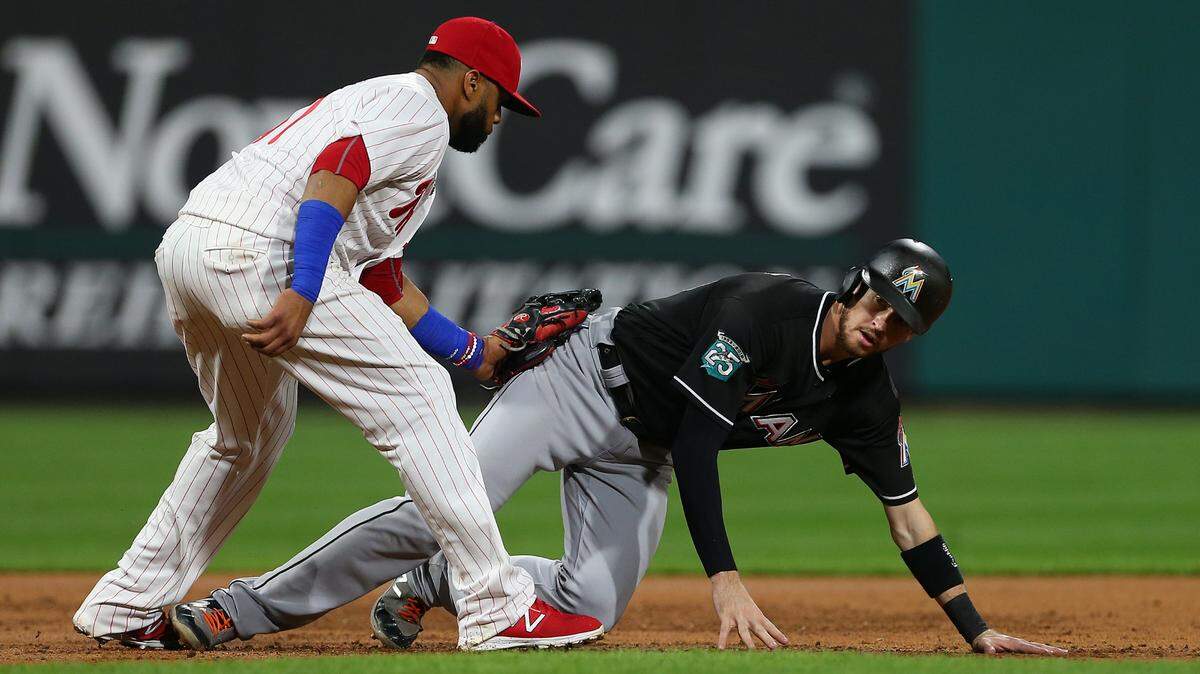 Miami Marlins’ JT Riddle is tagged out by Philadelphia Phillies third baseman Carlos Santana after falling on an attempt to steal third base during the second inning of a game at Citizens Bank Park on September 15, 2018 in Philadelphia.