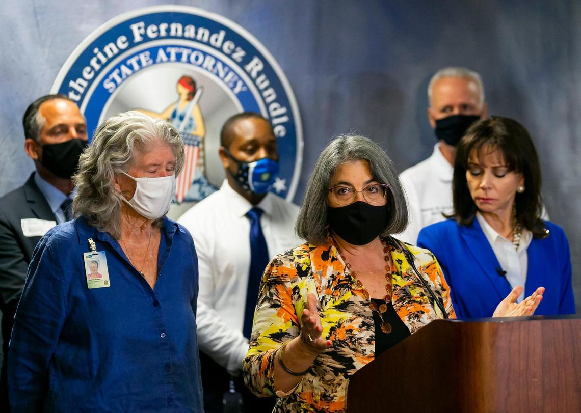 Miami-Dade County Mayor Daniella Levine Cava speaks during a press conference at the offices of State Attorney Katherine Fernandez Rundle, far right, in Miami, Florida, on Wednesday, Sept. 8, 2021. Fernandez Rundle announced three arrests made in identity theft cases that targeted victims from the Champlain Towers South condominium collapse.
