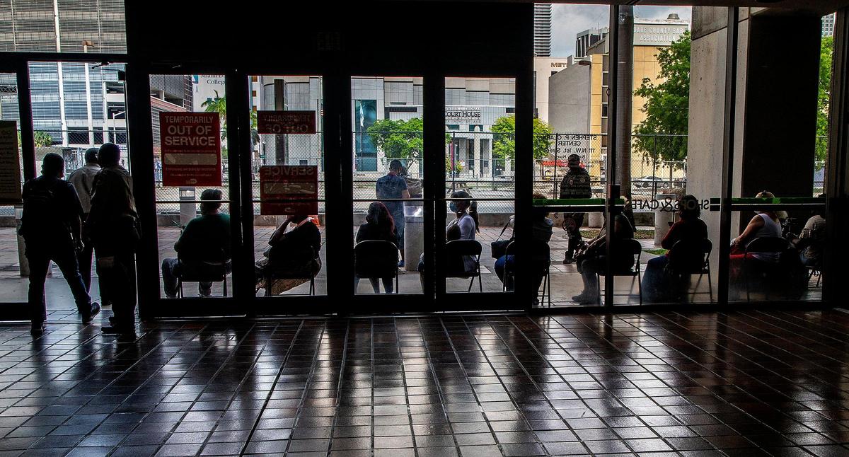 A large group of Miami-Dade residents lined up outside the building to enter the Golden Passport office to renew free transit passes on the office’s first day open since the pandemic started. The renewal office reopened Thursday, May 20, 2021, with a three-hour wait at the Stephen P. Clark Center. The county has extended the deadline for renewing the cards until Sept 30, but many people aren’t aware of the extension.