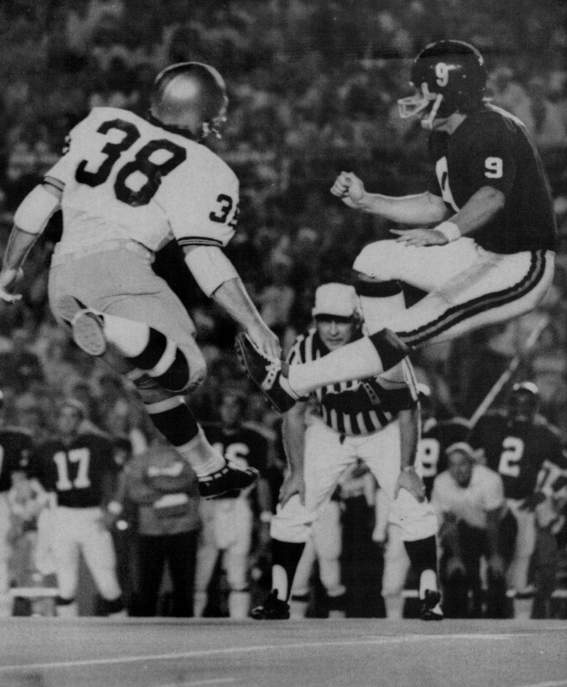 UM’s Mike Burke punts during a game against Notre Dame in the Orange Bowl in 1971.