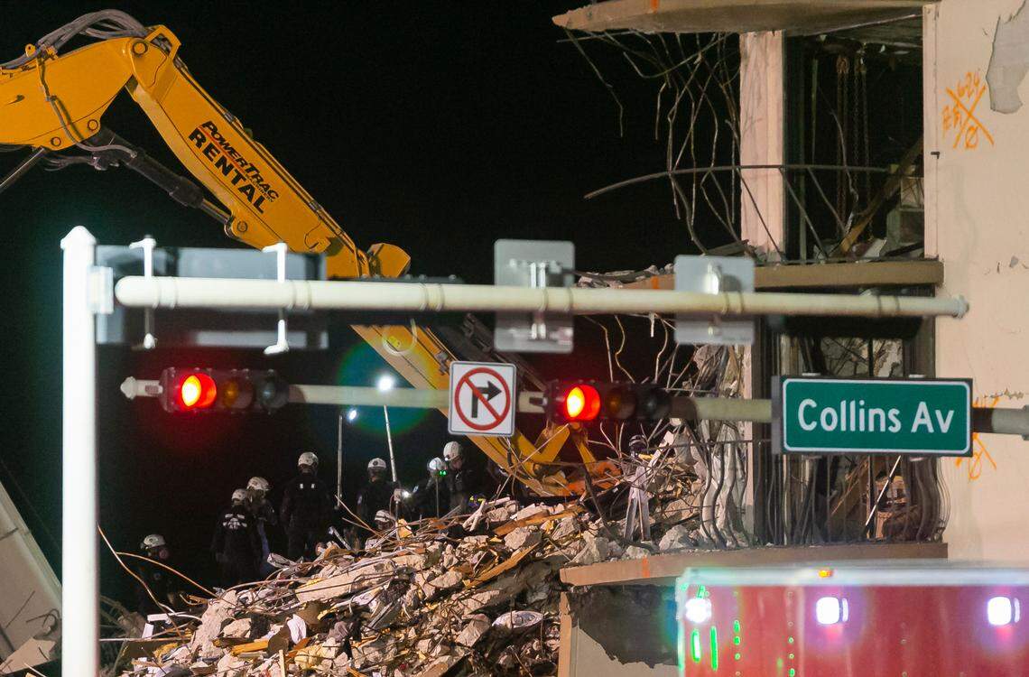 South Florida Urban Search and Rescue team look through rubble for survivors at the partially collapsed Champlain Towers South Condo building in Surfside, Florida on Wednesday, June 30, 2021.