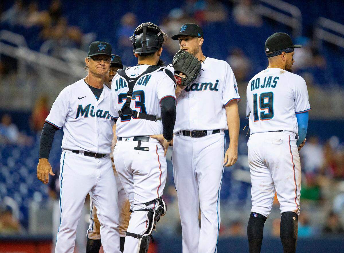 Miami Marlins manager Don Mattingly visits the mound to relieve Jesus Luzardo (44) with Ross Detweiler (54) during the fifth inning of an MLB game against the Washington Nationals at loanDepot park in the Little Havana neighborhood of Miami, Florida, on Tuesday, August 24, 2021.