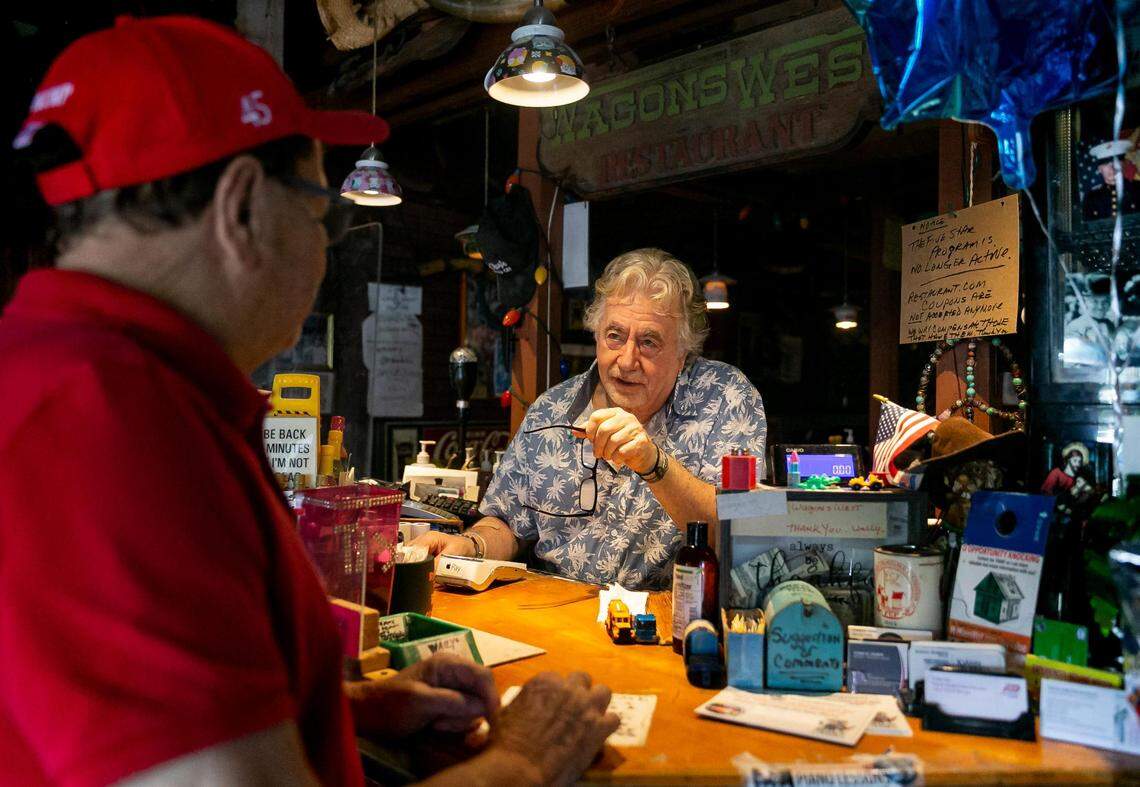 Walter ‘Wally’ Muench, the owner of Wagons West Restaurant, rings up a customer inside his diner on Friday, July 1, 2022, in Pinecrest. 