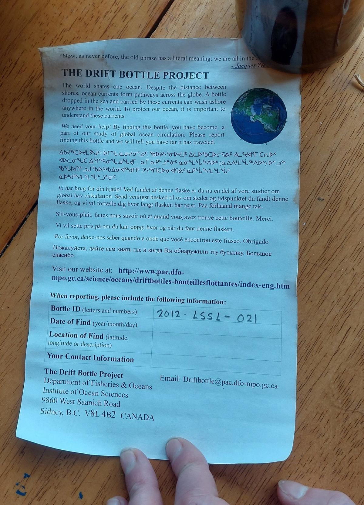 Information about the Drift Bottle Project was rolled up inside.