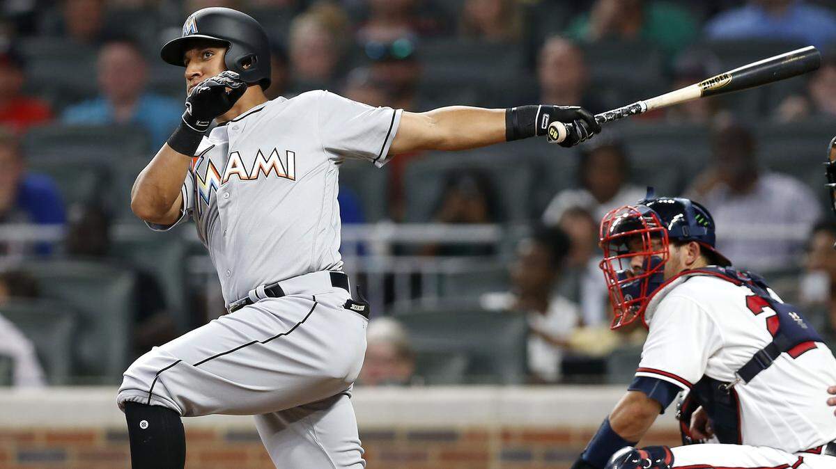 ATLANTA, GA - AUGUST 14:  Pinch hitter Christopher Bostick #48 of the Miami Marlins hits an RBI double in the sixth inning during the game against the Atlanta Braves at SunTrust Park on August 14, 2018 in Atlanta, Georgia.  (Photo by Mike Zarrilli/Getty Images)