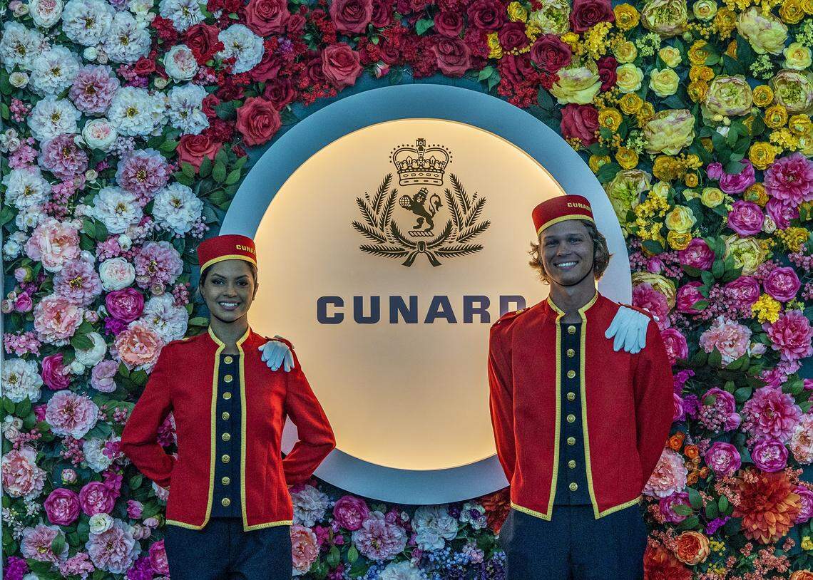 Hostesses welcome guests and passengers to the Cunard cruise ship Queen Elizabeth as it sits docked at PortMiami on Thursday, Oct. 16, 2025, in Miami. The vessel arrived around 6 a.m. and will be based in Miami for six months, offering voyages to the Caribbean. After tours and festivities, the ship is scheduled to depart later Thursday on its inaugural 12-night Caribbean cruise.