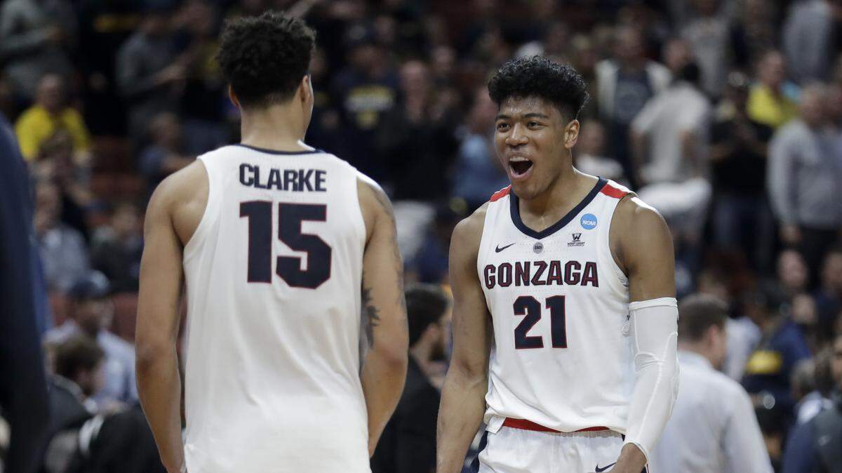Gonzaga forward Rui Hachimura, right, and forward Brandon Clarke celebrate the team’s win against Florida State during an NCAA men’s college basketball tournament West Region semifinal Thursday, March 28, 2019, in Anaheim, Calif.