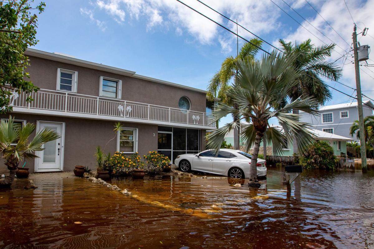 A house sits just above floodwaters off North Blackwater Lane during flooding due to Hurricane Ian at Stillwright Point in Key Largo, Florida, on Thursday, Sept. 29, 2022.