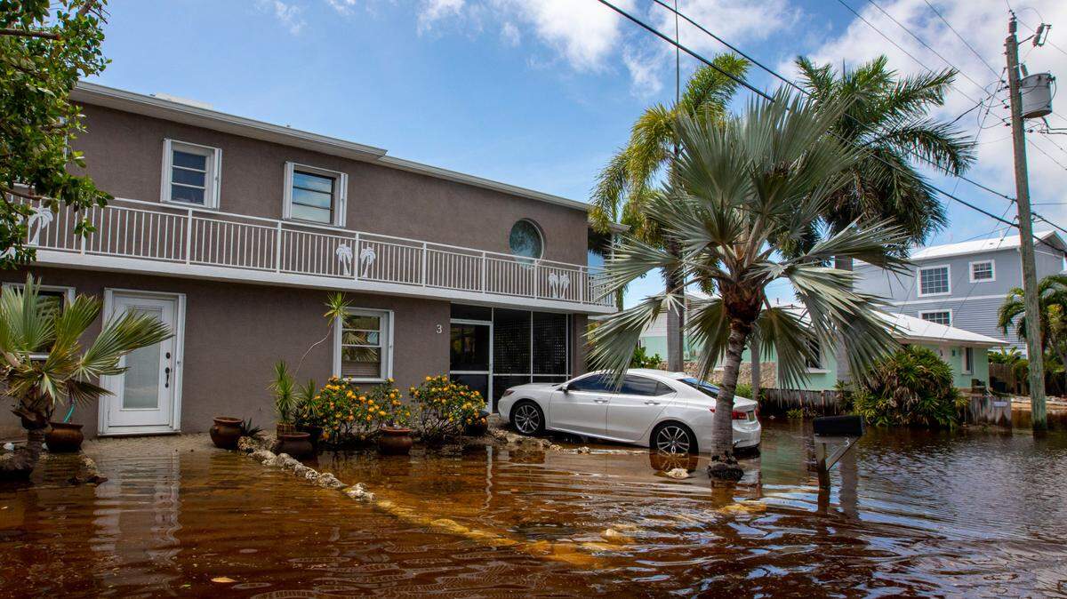 A house sits just above floodwaters off North Blackwater Lane during flooding due to Hurricane Ian at Stillwright Point in Key Largo, Florida, on Thursday, Sept. 29, 2022.