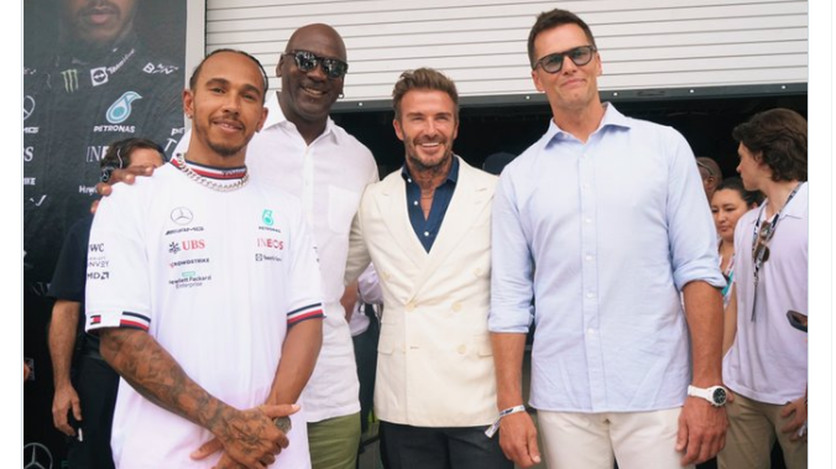 Tampa Bay Buccaneers quarterback Tom Brady (right) took a photo with other sports legends such as Michael Jordan (middle left), David Beckham (middle right) and Lewis Hamilton (left) at the Crypto.com Miami Grand Prix on Sunday, May 8, 2022.