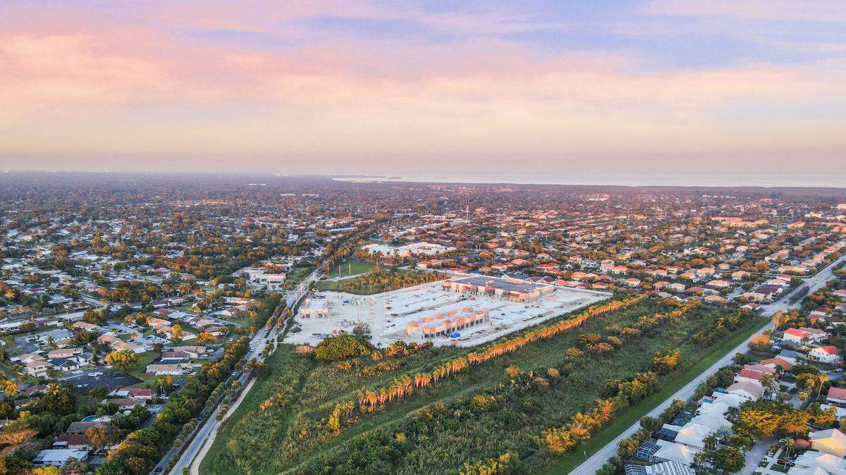 An aerial view of Old Cutler Road in Cutler Bay shows a publicly owned 16-acre plot of vacant land the town will convert into a central park and town center for the South Miami-Dade County suburb of about 45,000. About three acres of the tract will be set aside for a town hall and police building.