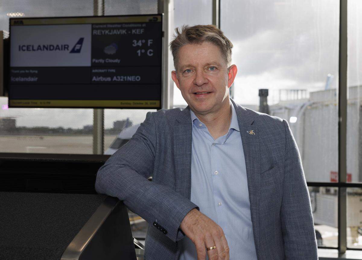 Bogi Nils Bogason, president of Icelandic Air, poses in front of the screen during a ceremony introducing the only direct flight between Miami and Iceland on Icelandair on Sunday, Oct. 26, 2025, at Miami International Airport in Miami, Fla.