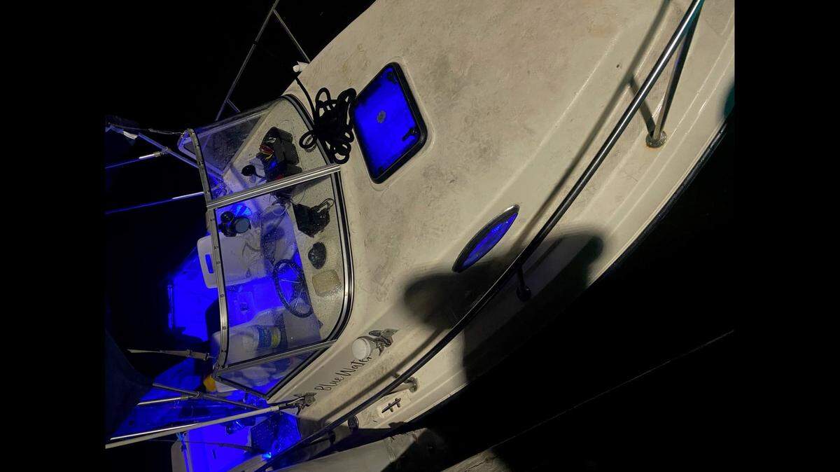 The U.S. Coast Guard rescued six off of this 20-foot pleasure craft, Blue Water, near the entrance to Pensacola Bay after the boat took on water on March 9, 2021.