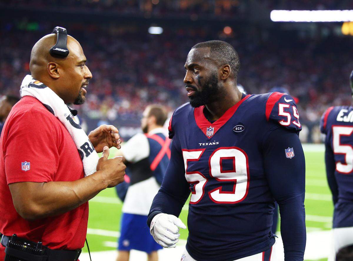 Jan 5, 2019; Houston, TX, USA; Houston Texans defensive line coach Anthony Weaver talks with linebacker Whitney Mercilus (59) against the Indianapolis Colts in the AFC Wild Card playoff football game at NRG Stadium. Mandatory Credit: Mark J. Rebilas-USA TODAY Sports