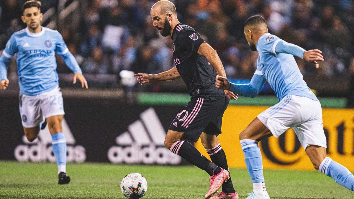Inter Miami forward Gonzalo Higuain dribbles through New York City FC defenders during the MLS playoff game at Citi Field in New York on Oct. 17, 2022.
