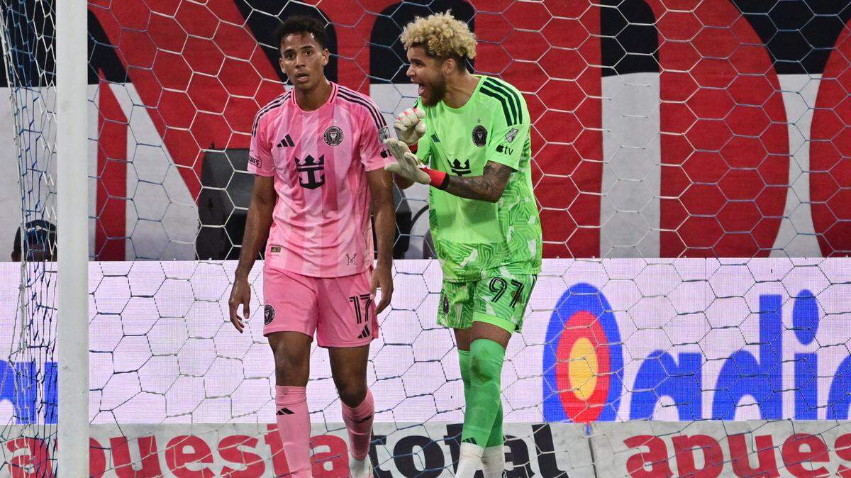 Inter Miami's Canadian goalkeeper #29 Dayne St. Clair talks with teammate Jamaican defender #17 Ian Fray during the friendly football match between Peru's Alianza Lima and the US' Inter Miami at the Alejandro Villanueva Stadium in Lima on January 24, 2026. (Photo by Connie FRANCE / AFP via Getty Images)